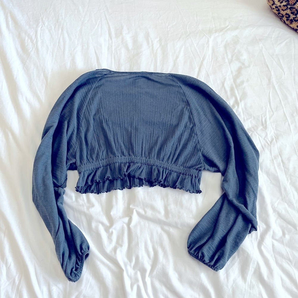 FP Beach top. Billowy sleeves gather at wrist. Grey blue. Kinda flat color.